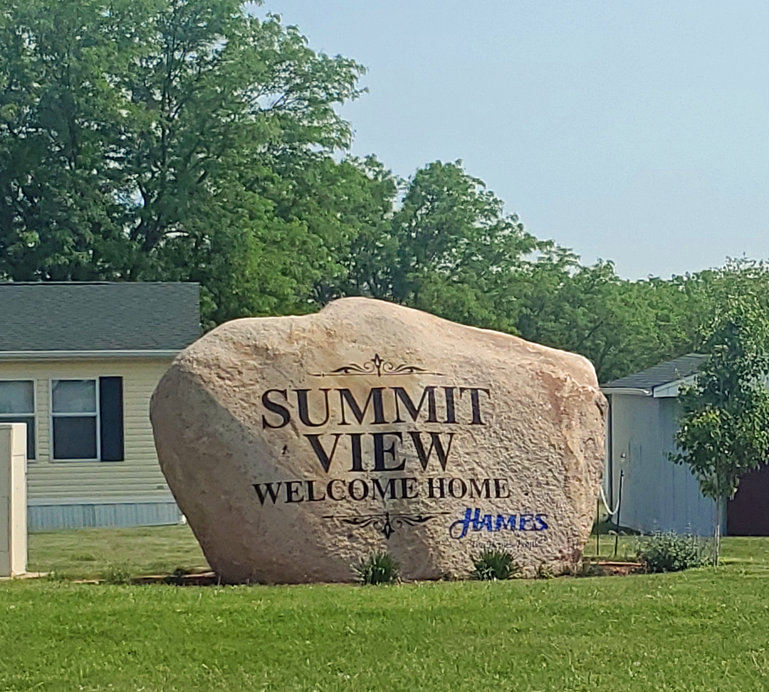 SV The Boulder Sign Closer Green Grass Blue Sky.jpg