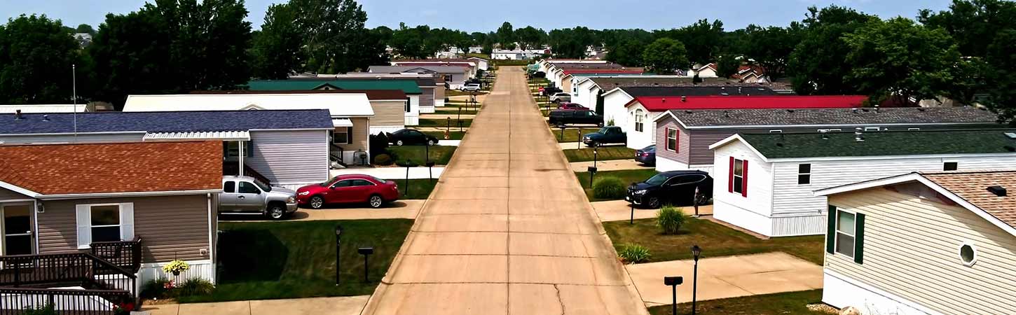 An aerial view of a Hames Homes street with many houses on either side