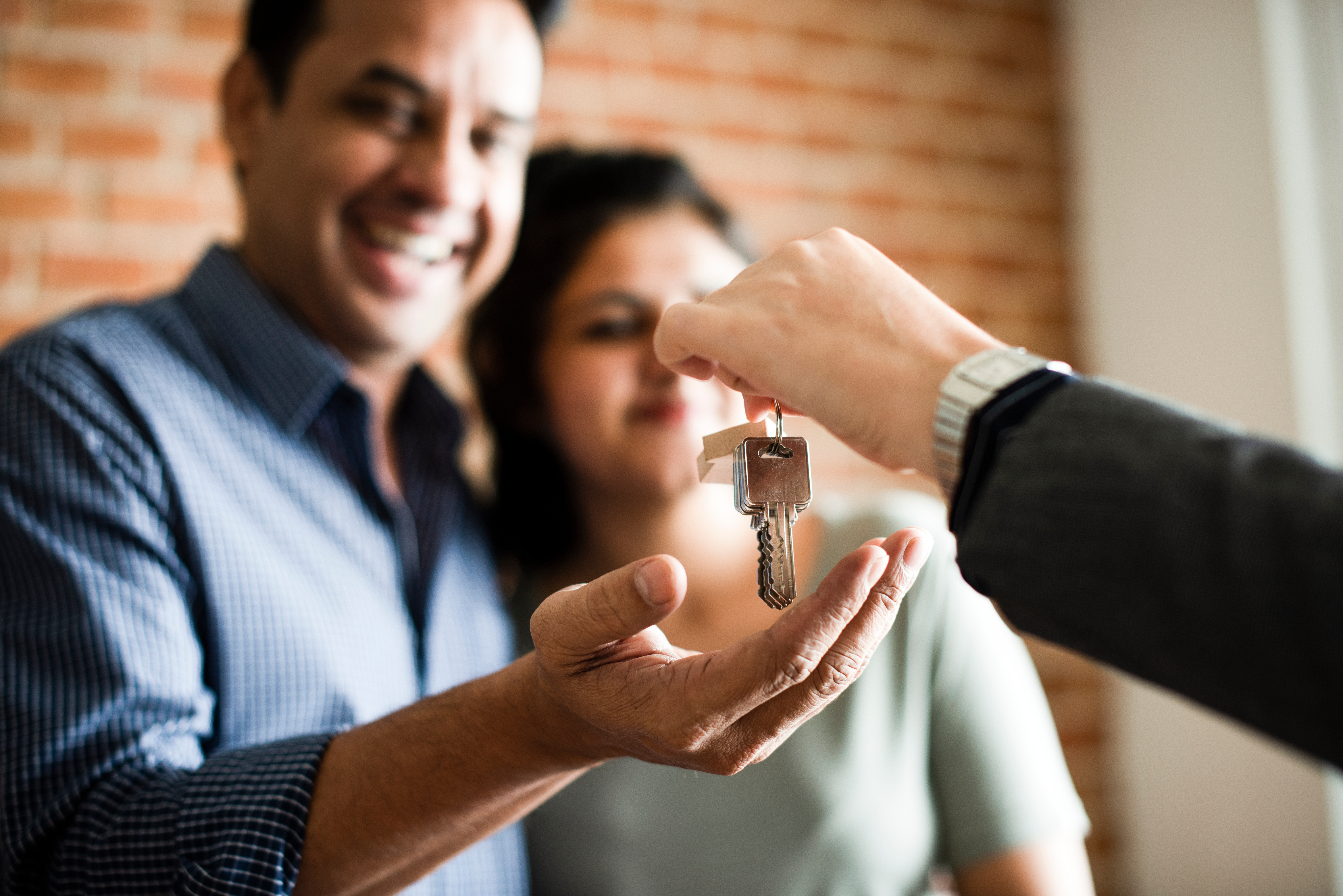 Happy non white Couple Purchasing Home keys.jpeg