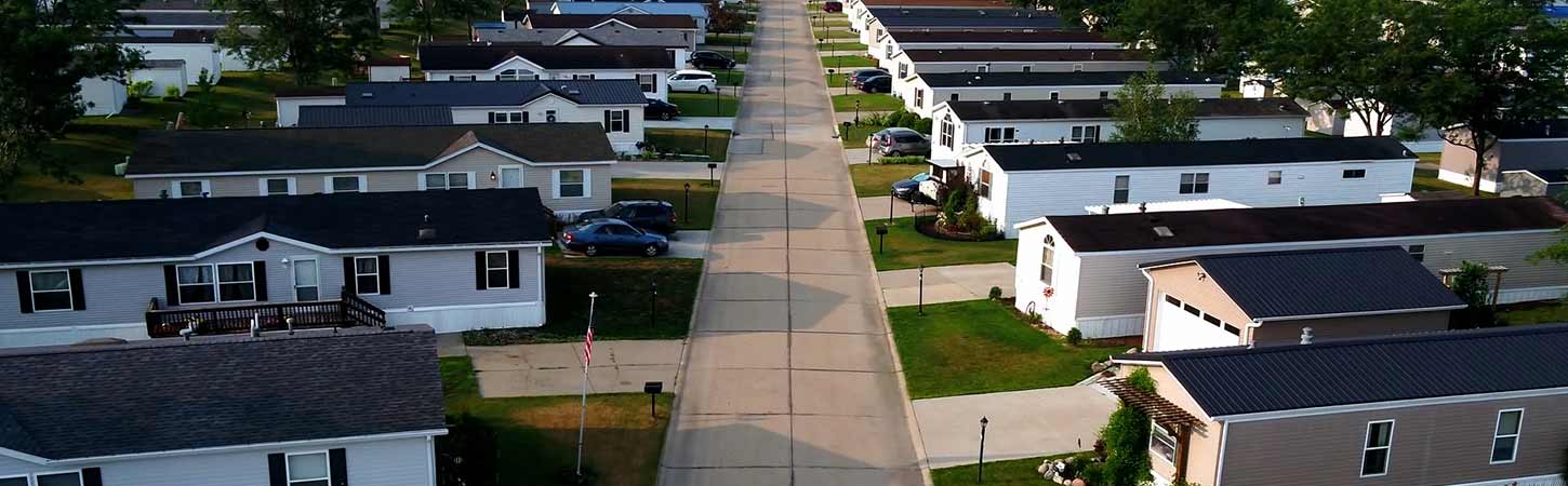 An aerial view of a Hames Homes street with many houses on either side